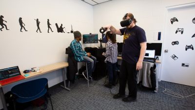 Student using VR in gaming studio